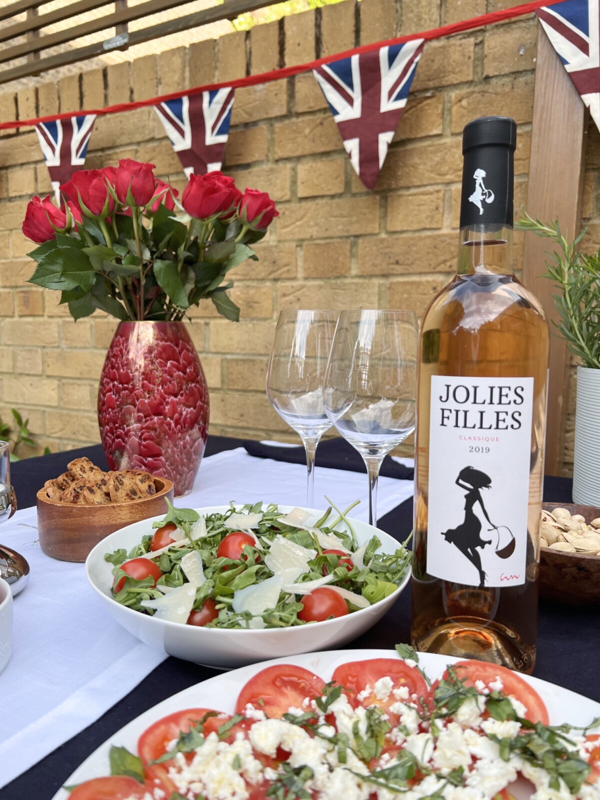 A summer salad with a bottle of provence rosé